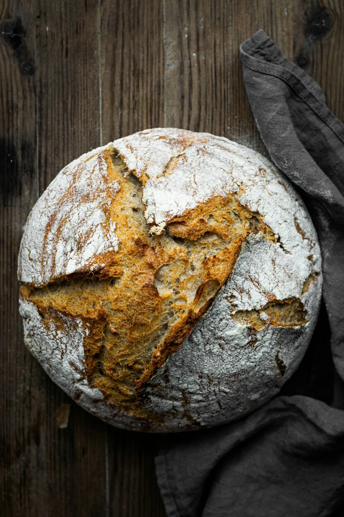Open honeycomb crumb of naturally leavened sourdough country loaf